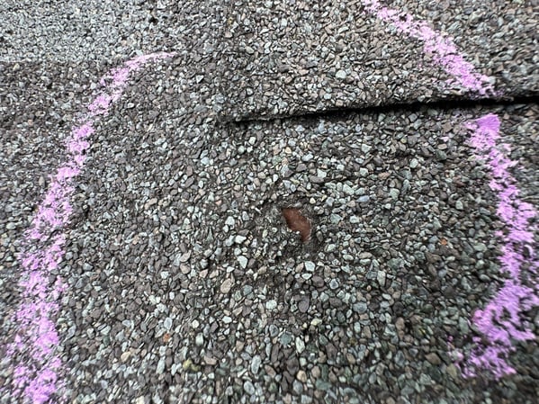 Hail impact on asphalt shingle