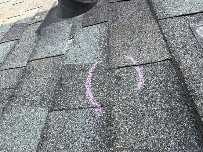 Hail impact on asphalt shingle